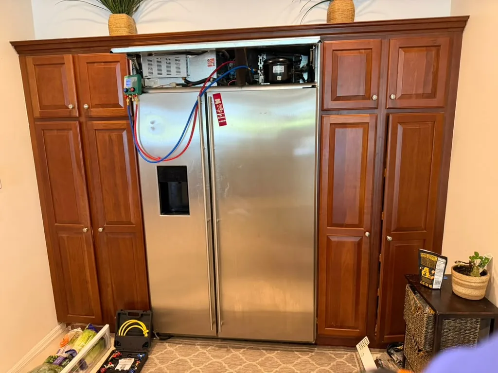 Refrigerator connected to service gauges during diagnosis